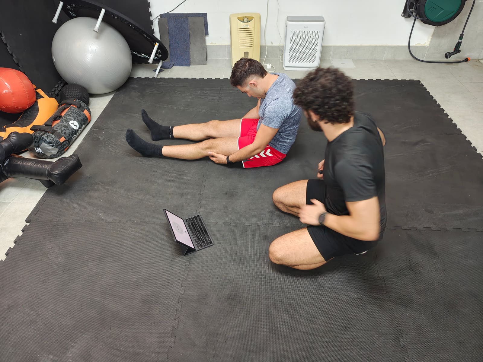 Overhead view of a movement assessment on the mats