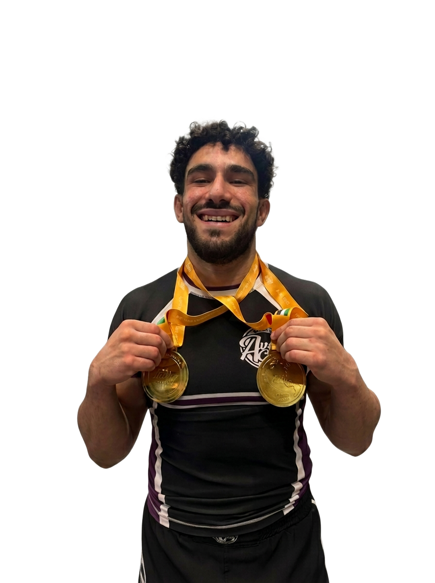 Joel Dimech holding two gold medals